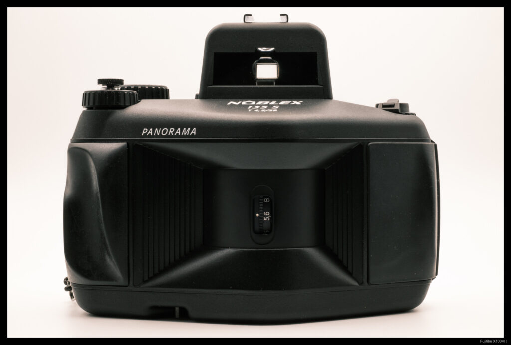 A head-on view of a KWD Noblex 135S with a soft shutter release attached