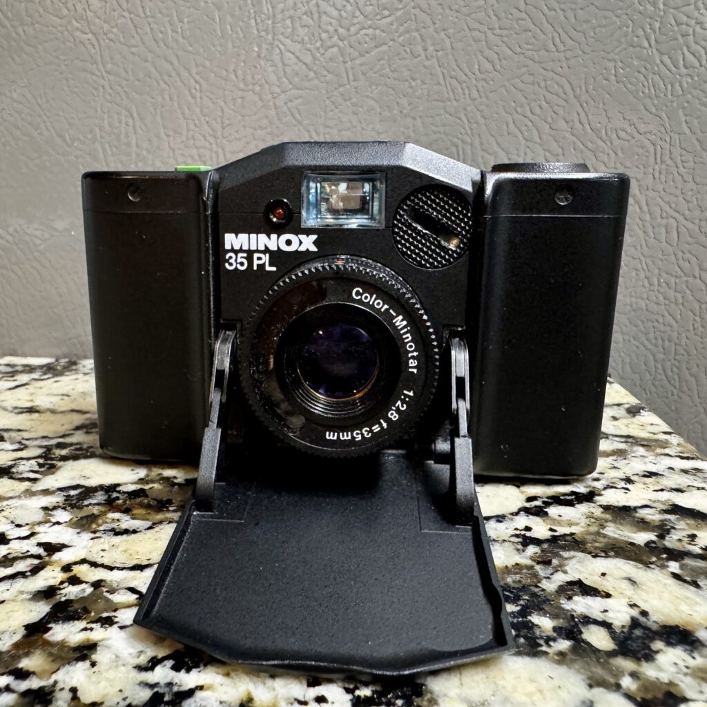 Minox front with lens extended