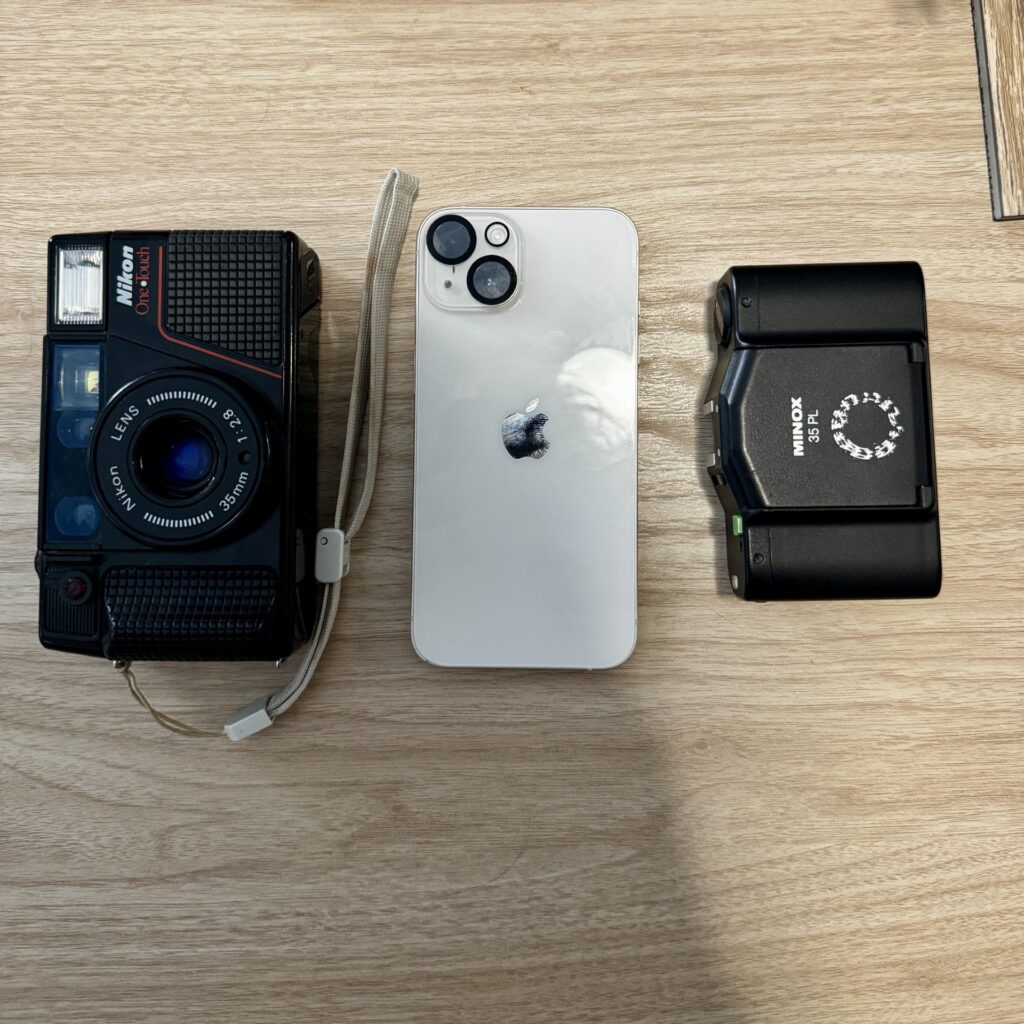 Minox compared to an iPhone 11 and Nikon L35AF2