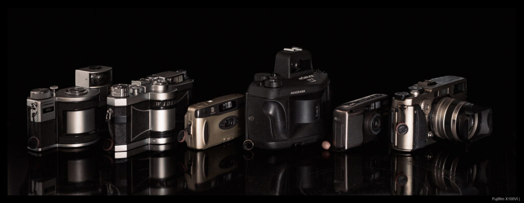 From left to right: KMZ Horizont, Panon Widelux F6, Minolta P's, KWD Noblex 135S, Ricoh R1, Fujifilm TX-1