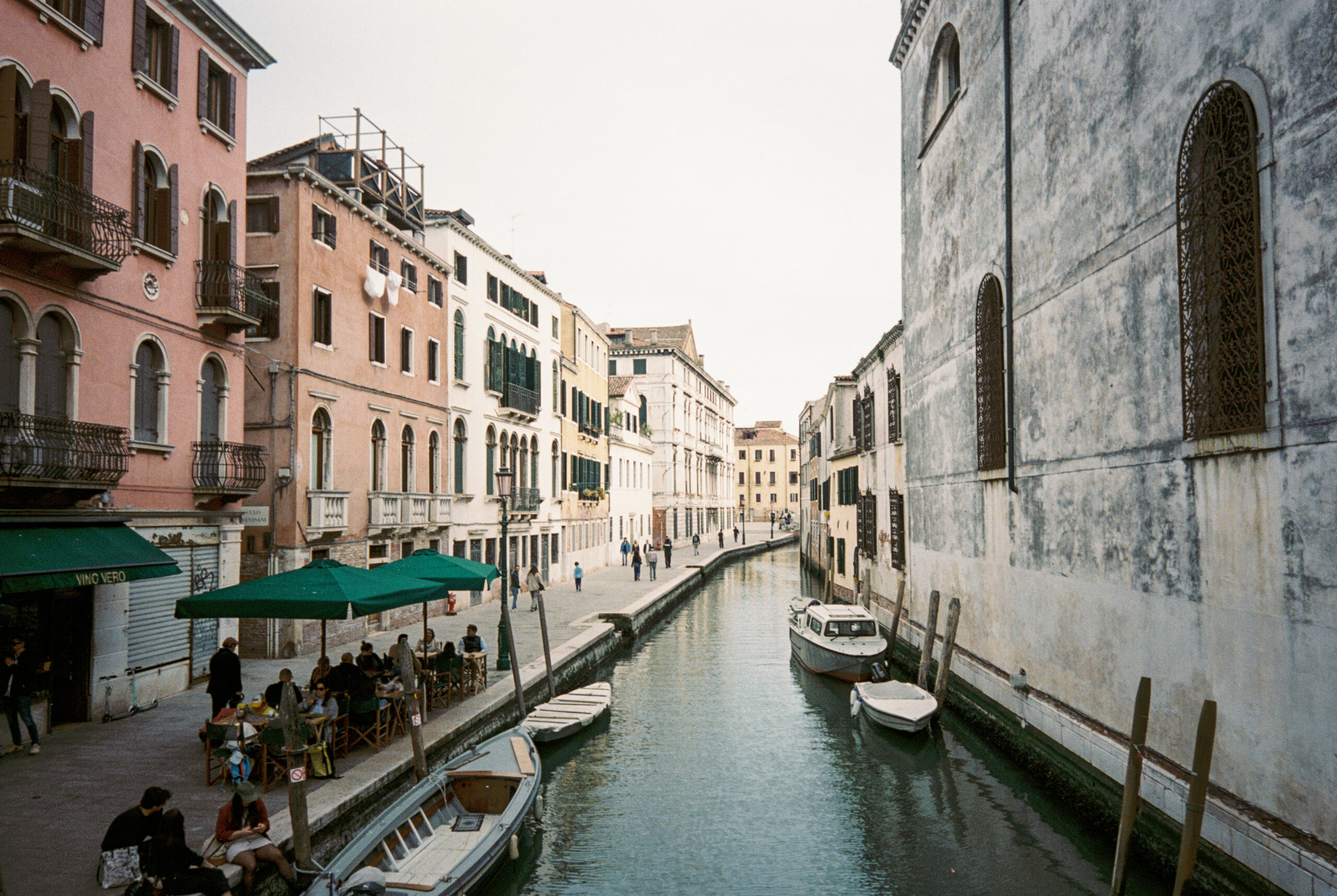 Canal along street in Venice, landscape. Shot on Portra 400.