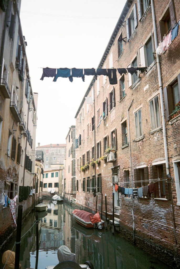 Clothing lines over a canal in Venice.
