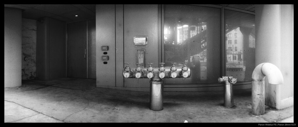 An image of a building side with slight distortion from the camera's lens movement. Perspective correction has been applied to straighten the image.