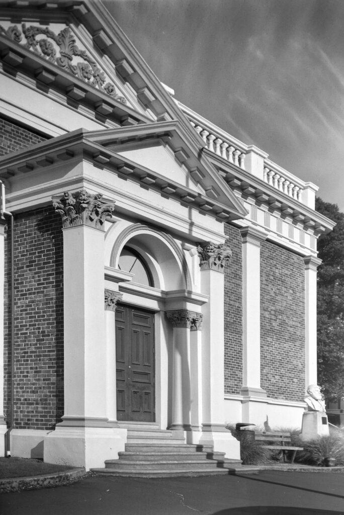 Entrance portico to classical revival building.