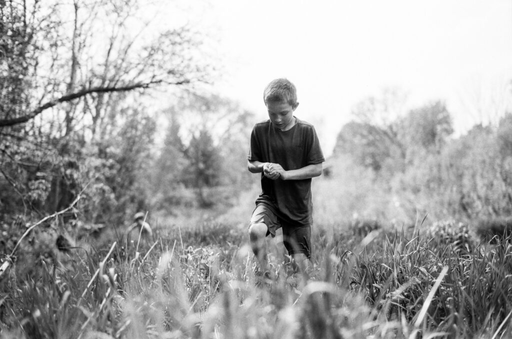 Boy holding a frog