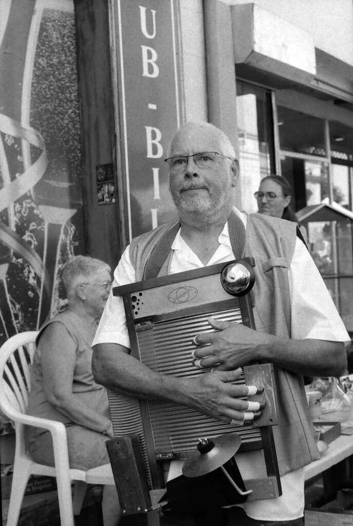 A team member, with a washboard