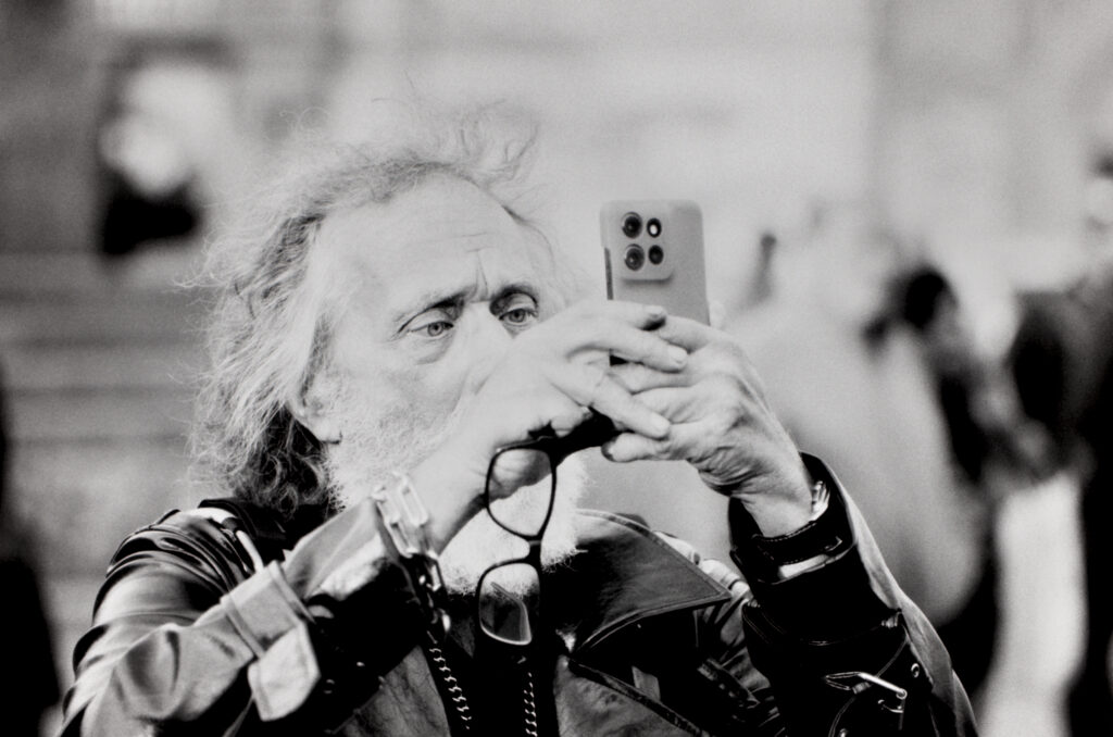 A man taking photos with his phone