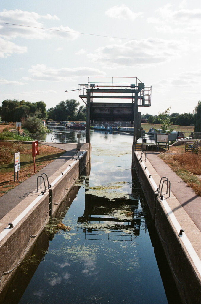 Empty Lock with reflections of the sky in the water