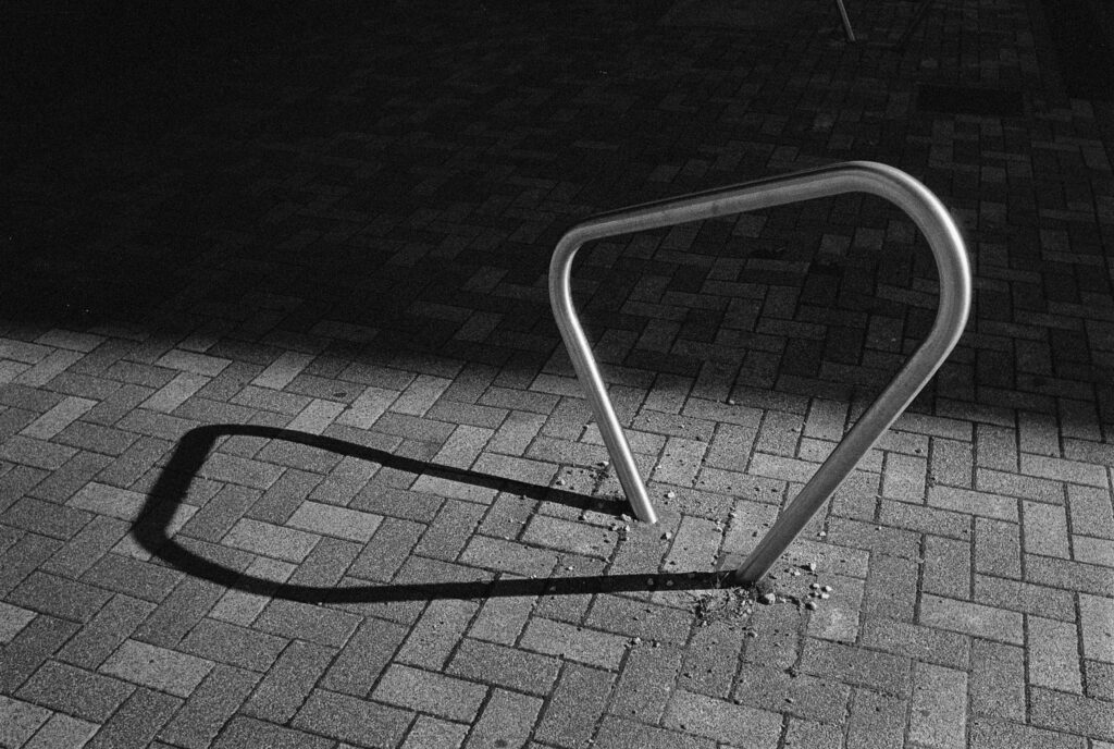 A bright metal loop contrasted against a background shadow