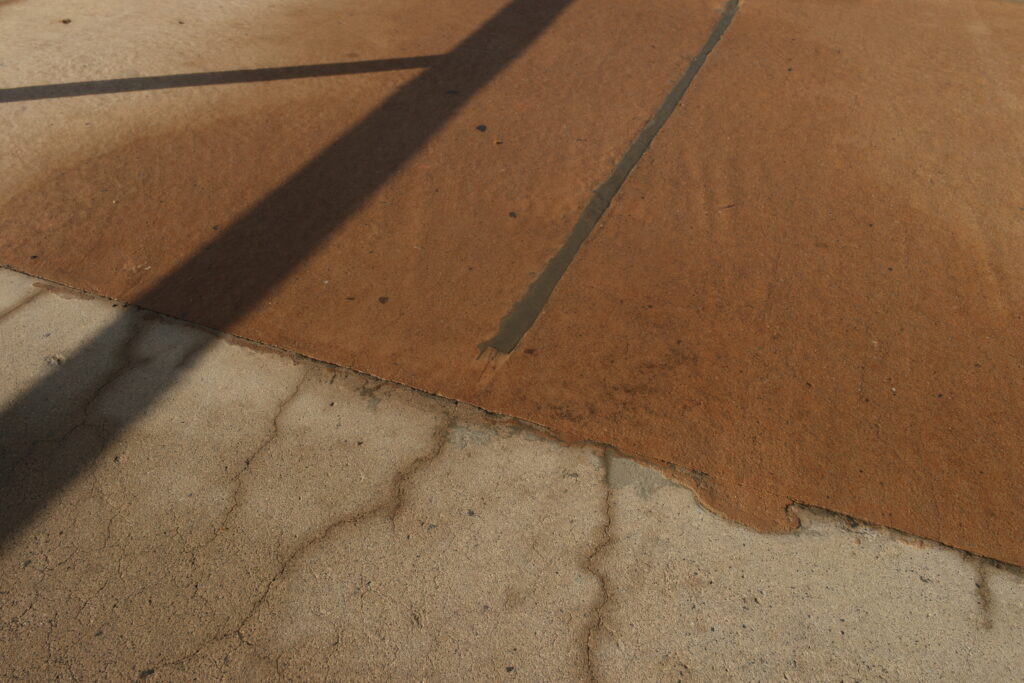 A photograph showing the drying surface of the skate park.