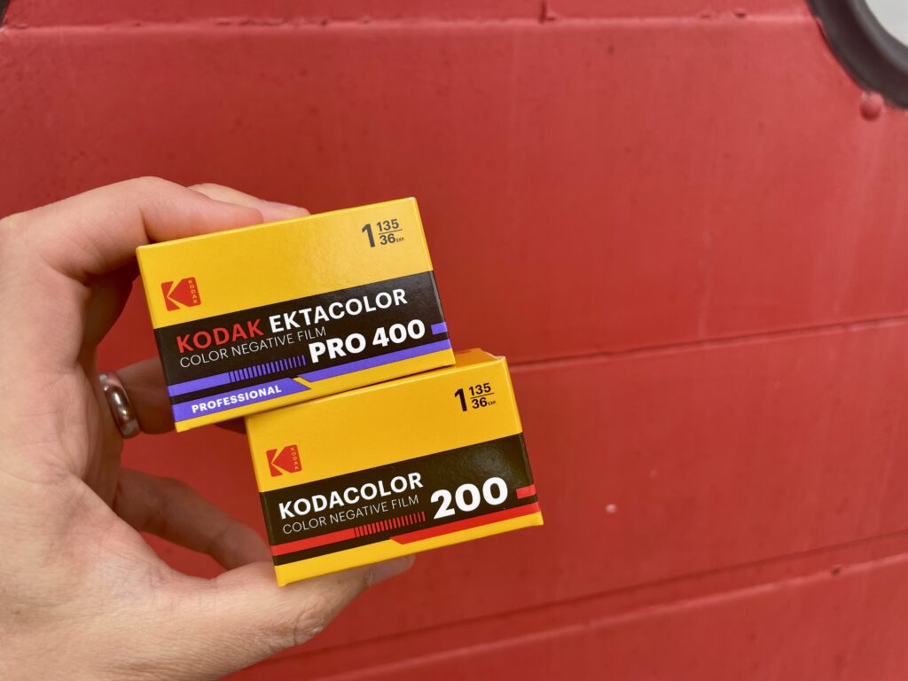 Kodak EKTACOLOR and KODACOLOR in front of a red garage door