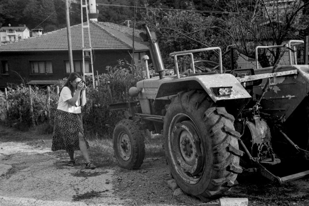 A female photographer shooting a tractor